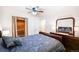 Comfortable main bedroom with ceiling fan, and a well-organized closet at 857 S Van Gordon Ct # I207, Lakewood, CO 80228