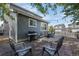 Backyard featuring a patio with outdoor furniture, a grill, and gray siding at 9603 Marmot Ridge Cir, Littleton, CO 80125