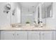 Bathroom vanity features double sinks with granite counters, providing ample space for your morning routine at 9603 Marmot Ridge Cir, Littleton, CO 80125