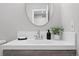 Bathroom featuring a modern vanity with a countertop sink and stylish fixtures at 9603 Marmot Ridge Cir, Littleton, CO 80125