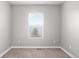 Bedroom featuring a large window and plush carpet, this room is ready for your personal touch at 9603 Marmot Ridge Cir, Littleton, CO 80125