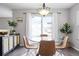 Dining area featuring a glass table and modern chandelier at 9603 Marmot Ridge Cir, Littleton, CO 80125