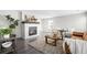 Bright living room featuring a fireplace with wood mantel and neutral decor at 9603 Marmot Ridge Cir, Littleton, CO 80125