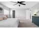 This main bedroom boasts a ceiling fan, plush carpet, and ample space, creating a relaxing retreat at 9603 Marmot Ridge Cir, Littleton, CO 80125