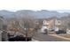 Street view of neighborhood, capturing neighboring homes and mountain views at 9603 Marmot Ridge Cir, Littleton, CO 80125