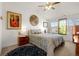 Comfortable bedroom with large windows, stylish décor, and a ceiling fan at 7501 S Addison Way, Aurora, CO 80016