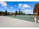 Outdoor bocce ball court with wooden pergolas, bench seating, and beautiful landscaping for outdoor enjoyment at 7501 S Addison Way, Aurora, CO 80016