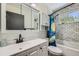 Bathroom featuring white subway tile walls, updated vanity, and a Starry Night shower curtain at 10541 Routt St, Westminster, CO 80021