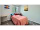 Cozy bedroom featuring plush carpet, natural light from a large window, and neutral paint at 10541 Routt St, Westminster, CO 80021