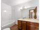 This bathroom includes a sink with cabinet and shower over tub at 760 Century Pl # A, Monument, CO 80132