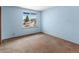 This bedroom features light blue walls and a window view of the neighborhood at 760 Century Pl # A, Monument, CO 80132