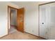 Bedroom featuring closet and open doorway with neutral-toned walls and carpet at 760 Century Pl # A, Monument, CO 80132