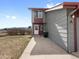 Side exterior view with vinyl siding, mountain views, and a well-maintained lawn at 760 Century Pl # A, Monument, CO 80132