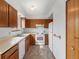 Functional kitchen with wood cabinets and white appliances at 760 Century Pl # A, Monument, CO 80132