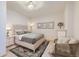 Spacious bedroom with a comfortable bed and additional seating at 15843 E 13Th Ave, Aurora, CO 80011