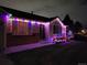 House exterior decorated with colorful lights at night at 15843 E 13Th Ave, Aurora, CO 80011