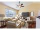 Bright living room featuring a comfortable sofa and large window at 15843 E 13Th Ave, Aurora, CO 80011