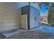 Gray storage shed with lockable doors in the backyard at 15843 E 13Th Ave, Aurora, CO 80011