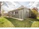 A well-maintained backyard features lush green grass and mature landscaping at 2504 S Yates St, Denver, CO 80219