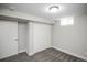 A carpeted bedroom with two closets and natural lighting at 2504 S Yates St, Denver, CO 80219