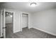This bedroom has an open closet and is connected to another room at 2504 S Yates St, Denver, CO 80219