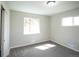 Cozy bedroom with new carpet, and a view of the yard at 2504 S Yates St, Denver, CO 80219