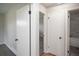 Bright hallway with neutral paint and white doors offer a clean and modern look at 2504 S Yates St, Denver, CO 80219