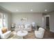Sunlit living room featuring hardwood floors, neutral decor, and lots of space at 2504 S Yates St, Denver, CO 80219