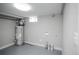 Utility room with water heater and washer dryer hookups at 2504 S Yates St, Denver, CO 80219