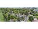 Expansive community aerial showcases lush trees, sidewalks, and views of the city skyline at 4218 S Alton St, Greenwood Village, CO 80111
