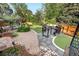Landscaped backyard with a patio and a barbecue area at 4218 S Alton St, Greenwood Village, CO 80111
