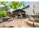 Charming backyard featuring brick patio, gazebo with fireplace, and fountain with statue, ideal for outdoor living at 4218 S Alton St, Greenwood Village, CO 80111