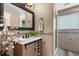 Renovated bathroom featuring a walk-in shower, modern vanity, and stylish decor at 4218 S Alton St, Greenwood Village, CO 80111