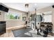 Home gym featuring modern exercise equipment and a wall of mirrors for a great workout space at 4218 S Alton St, Greenwood Village, CO 80111