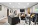 Finished basement living area featuring stairs and a tv at 4218 S Alton St, Greenwood Village, CO 80111