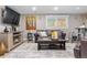Finished basement living room featuring a fireplace, tv, and comfortable seating at 4218 S Alton St, Greenwood Village, CO 80111