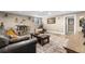 Spacious finished basement living area with bar stool seating and comfortable furnishings at 4218 S Alton St, Greenwood Village, CO 80111