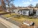 Aerial shot of a well-maintained home with a tidy yard and mature trees at 4389 S Sherman St, Englewood, CO 80113