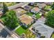 Aerial view showcasing the property, including a well-manicured lawn, patio, and surrounding neighborhood at 4389 S Sherman St, Englewood, CO 80113