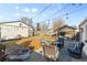 Spacious backyard featuring seating and a painted outbuilding at 4389 S Sherman St, Englewood, CO 80113