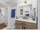 Updated bathroom featuring new lighting, vessel sink, and vanity with extra storage at 4389 S Sherman St, Englewood, CO 80113