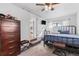 Comfortable bedroom with plush carpet, dresser, and convenient access to kitchen at 4389 S Sherman St, Englewood, CO 80113