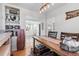 Rustic dining room with industrial-style lighting, farmhouse decor, and seating for six at 4389 S Sherman St, Englewood, CO 80113