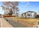 Attractive single-story house with a well-maintained yard and a welcoming front porch and a welcoming welcome sign at 4389 S Sherman St, Englewood, CO 80113