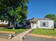 Cozy single-story home with a well-kept lawn and inviting front porch, perfect for enjoying the outdoors at 4389 S Sherman St, Englewood, CO 80113