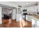Modern kitchen featuring white cabinets, granite countertops, and stainless steel appliances at 4389 S Sherman St, Englewood, CO 80113