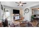 Cozy living room featuring hardwood floors, ceiling fan, and stylish decor at 4389 S Sherman St, Englewood, CO 80113