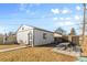Outbuilding with painted door and adjacent patio with picnic table at 4389 S Sherman St, Englewood, CO 80113