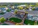 An aerial view of the property shows the backyard with patio, landscaping, and proximity to a lake at 14384 Big Stone Dr, Parker, CO 80134