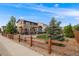Spacious backyard features a patio, lawn, and tasteful landscaping creating a private outdoor space at 14384 Big Stone Dr, Parker, CO 80134
